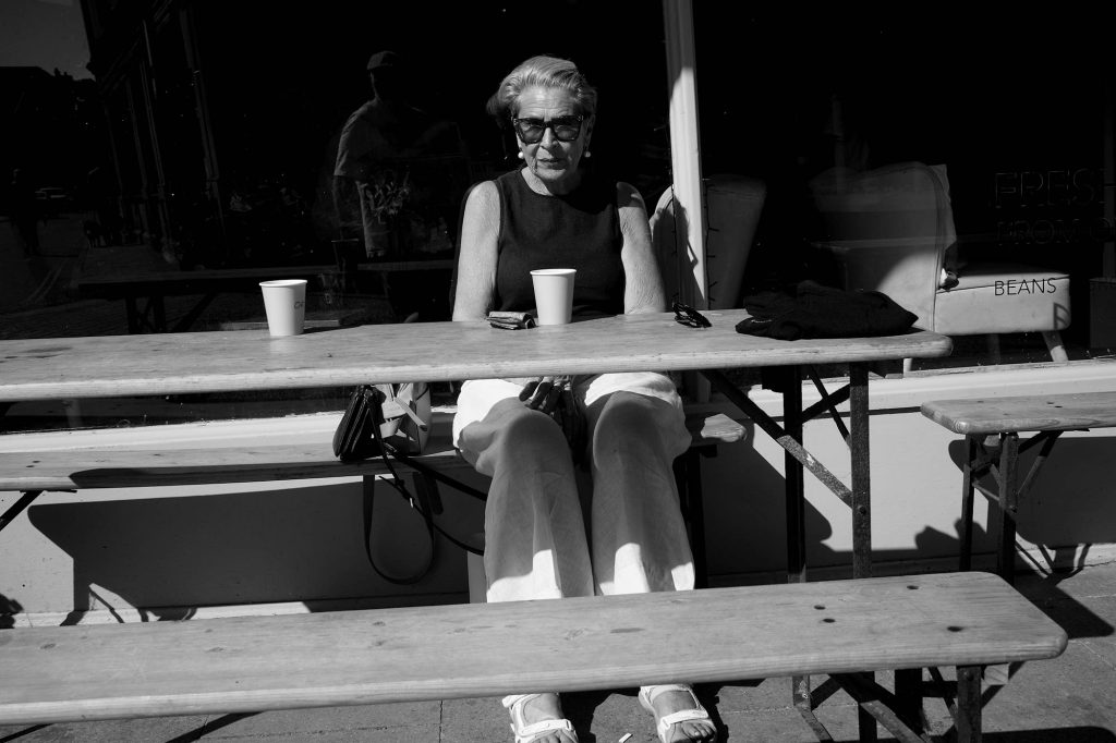 woman with coffee in black and white