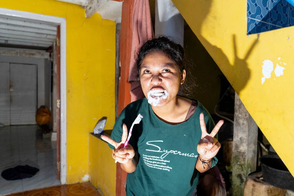 Woman brushing her teeth